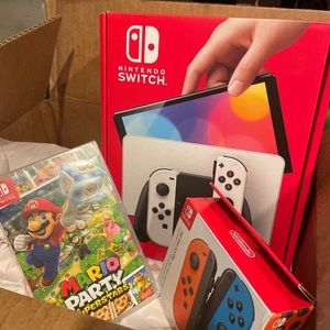 Nintendo switch OLED Mario superstars edition plus an extra pair of joy cons.